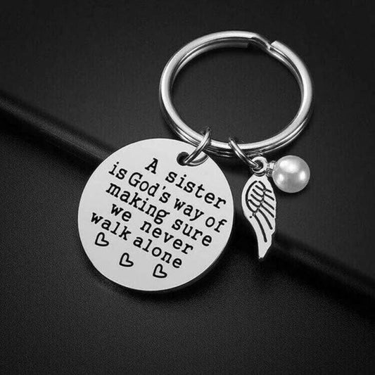 "A Sister is God's Way of Making Sure We Never Walk Alone" Keychaināš